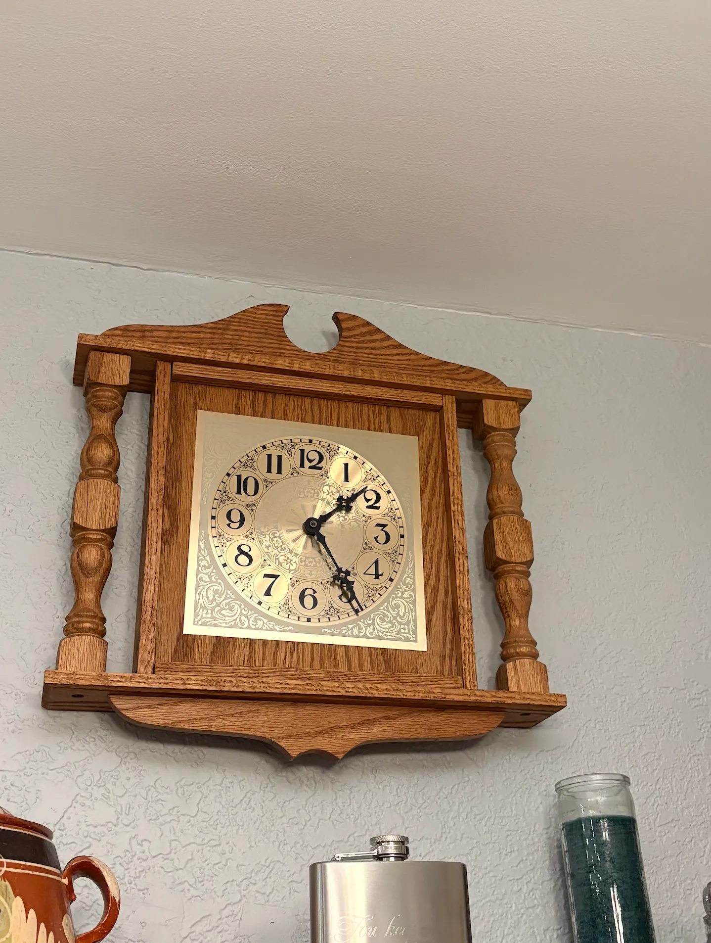An antique wooden wall clock